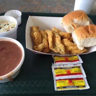 Small plate of fried fish, with coleslaw, and an extra order if a side of red beans (no rice for me)