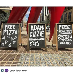 a group of free pizza signs