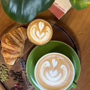 a cup of coffee and a croissant