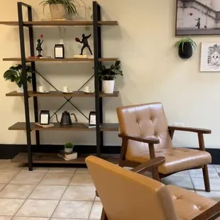 a living room with a leather chair