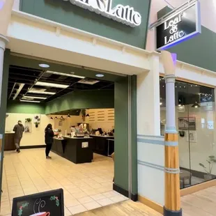 the entrance to a coffee shop