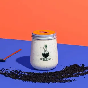  jar of coffee with a spoon next to it