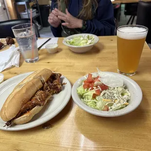 Pulled pork hoagie with a salad and draft IPA. Pretty good!