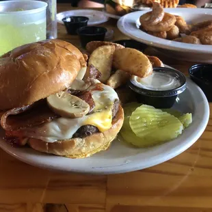 Merc Burger with mushrooms and potato wedges