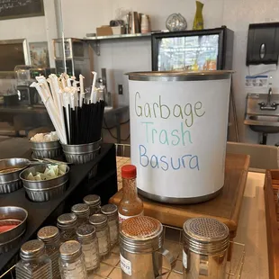 a kitchen counter with jars and spoons