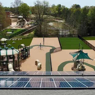 Aerial view of Playground Equipment/ Pond/ Solar Panels