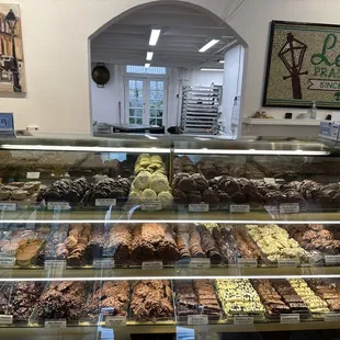 a variety of pastries in a display case