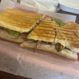 Cuban Sandwich in front , Chicken combo plate in back.