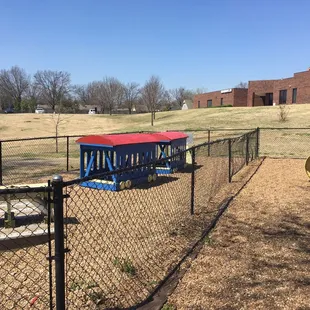 Toddler sized train. Fences all have gates as this is the church's park but open to the public.
