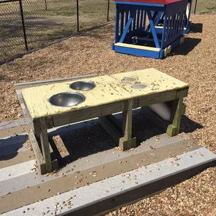 Play table for pea gravel.