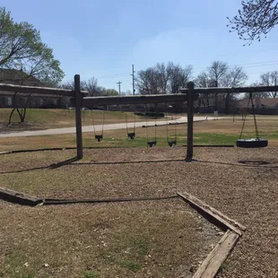 Baby swings!! The 2 lower swings have a chain across the front - for toddlers or kids who need help staying on the swing.