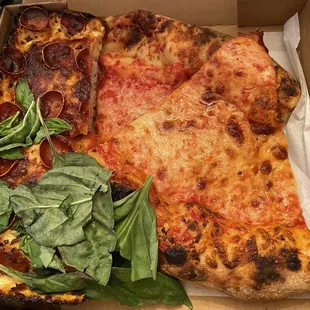 two slices of pizza in a box