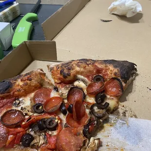 Burt pizza and under cooked dough underneath!