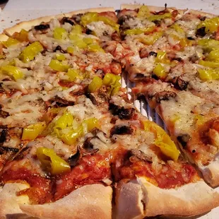 16" vegan pizza ($19 + $2.50/topping). Uses Violife vegan cheese. Nice cracker-thin crust. Good overall.