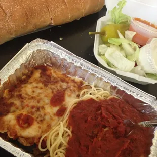 Eggplant Parmesan with garlic bread and a house salad