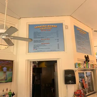 a bar with a menu on the wall
