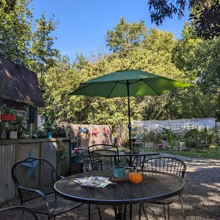 a patio with tables and chairs