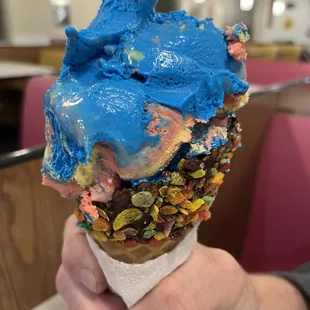 Superman Ice cream in a chocolate dipped fruit pebbles waffle cone... BF was in heaven!