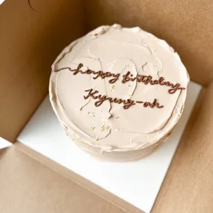 Lettering cake with textured buttercream base.