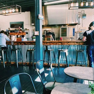 a view of the kitchen from the bar