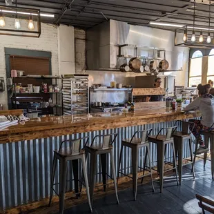 Open kitchen and bar seating