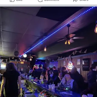 Locking from behind the bar to the patrons