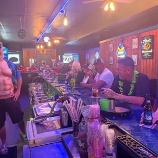 a group of people at a bar