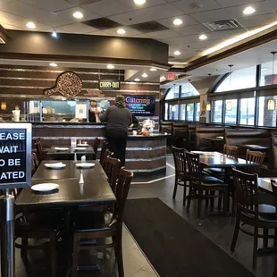 a restaurant with tables and chairs