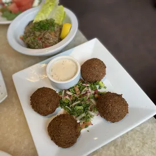 a plate of falaf and salad