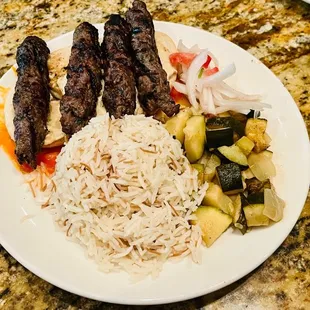 a plate of meat and rice
