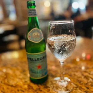 a glass of water and a bottle
