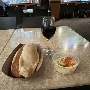 Warm pita with humus and a glass of wine - nice way to relax on the town square.