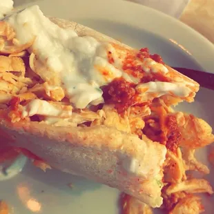 Chicken Shawarma Sandwich with lots of garlic sauce.