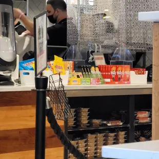 a man preparing food at a counter