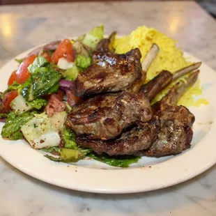 Seasoned Lamb chops grilled to perfection with their house salad and saffron rice!