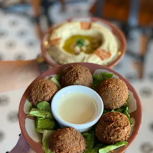 a person holding a plate of food