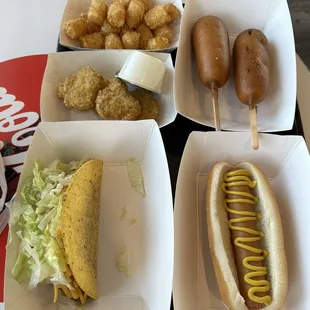 Tots,corndog,fried broccoli, spicy taco and hotdog.