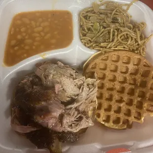 Pulled Pork on a waffle bun with baked beans and garlic noodles.