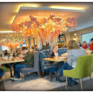 people sitting at tables in a restaurant