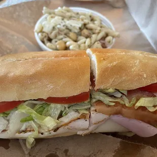 Half club sandwich with pasta salad