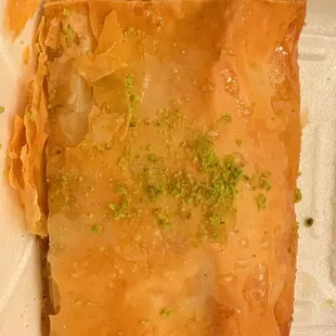 a close up of a pastry in a styrofoam container