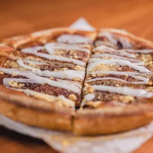 a sliced pizza on wax paper