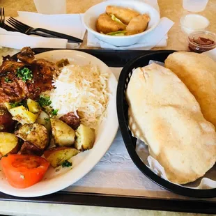 1/4 Rotisserie Chicken Platter with Rice and Roasted Potatoes, along with some Chicken Samosas.