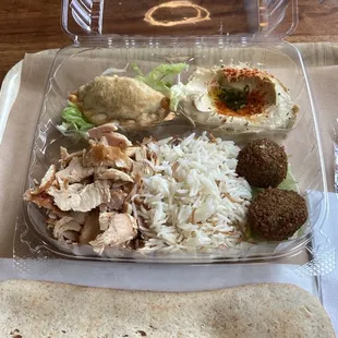 Pick Your Platter: 4 sides and 1 protein. Cheese fatayer, rice, falafel, hummus, and chicken shawarma