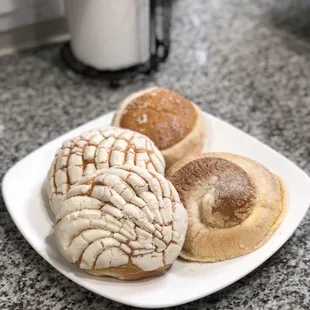 three pastries on a plate