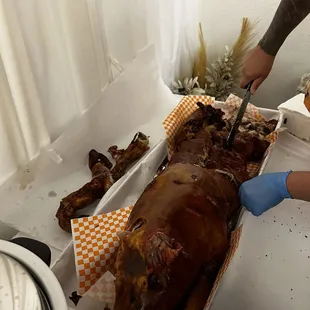 Lechon being cut