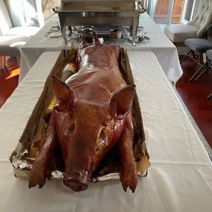 a roasting pig on a table
