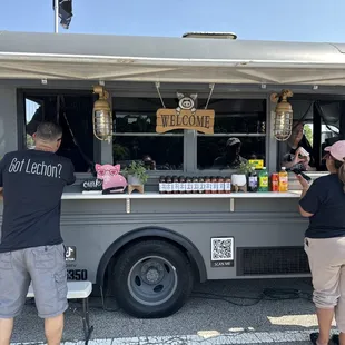 people ordering food from a food truck