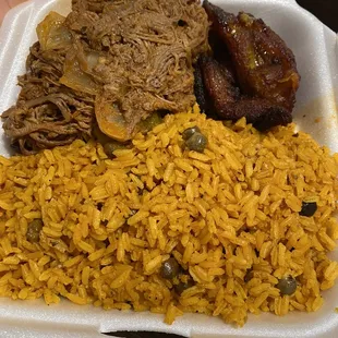 Arroz con gandules (pigeon peas and rice) with ropa vieja (shredded beef) and plantains.