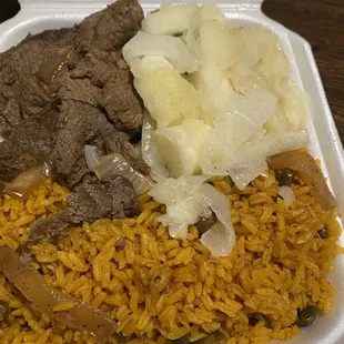 Arroz con gandules (rice and peas) with steak and onions with yucca